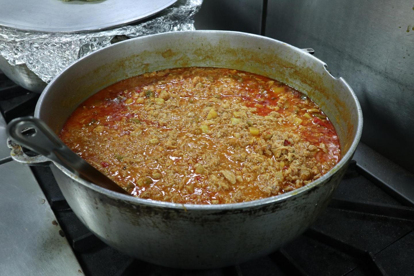 A giant pot of food cooking on a stove
