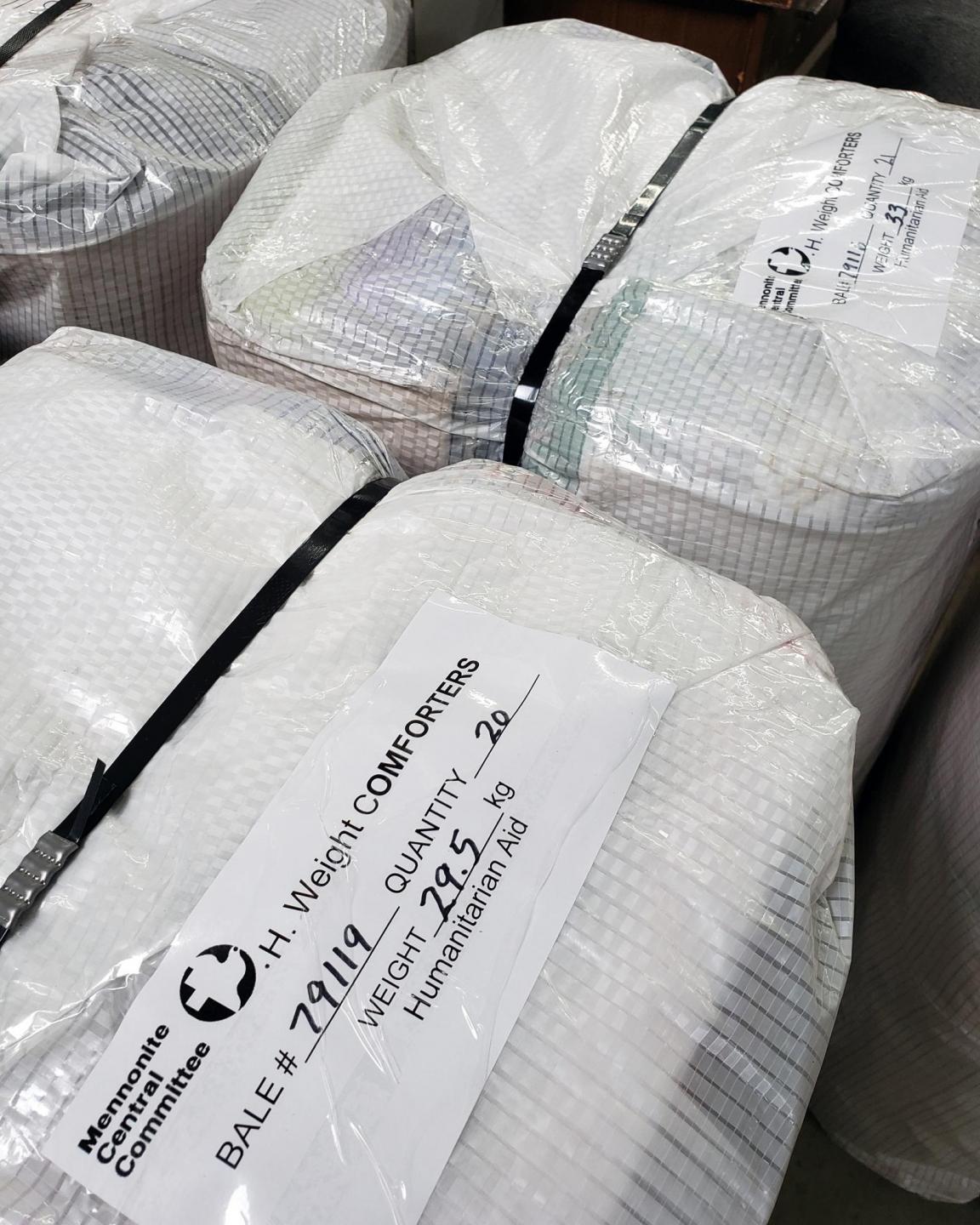 Bales wrapped in white plastic