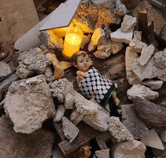 baby Jesus lying in the rubble