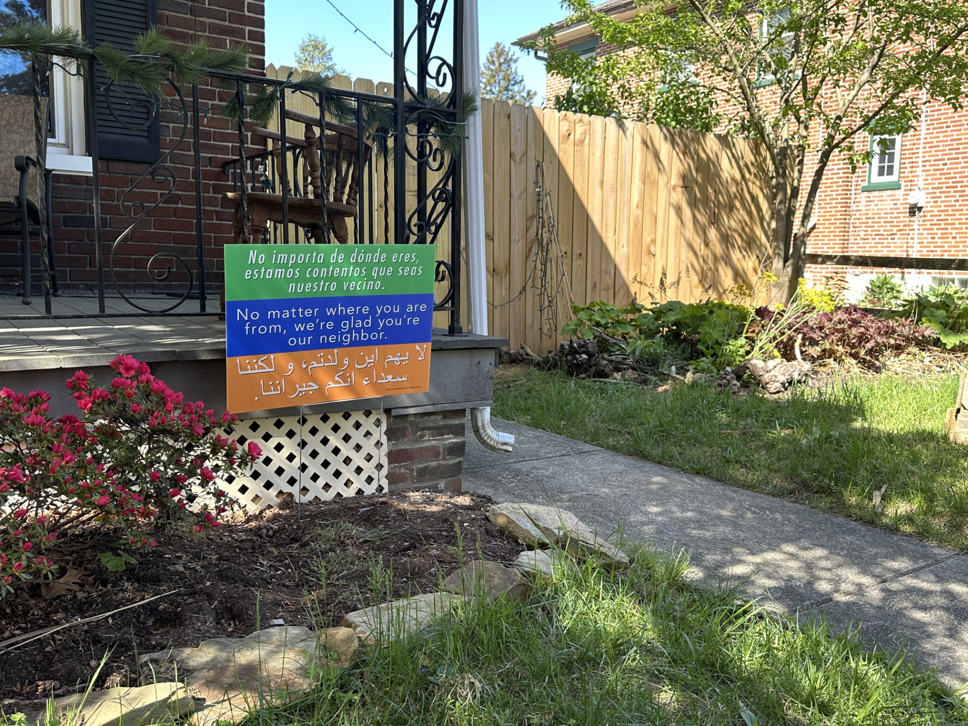 neighbor sign in a front yard