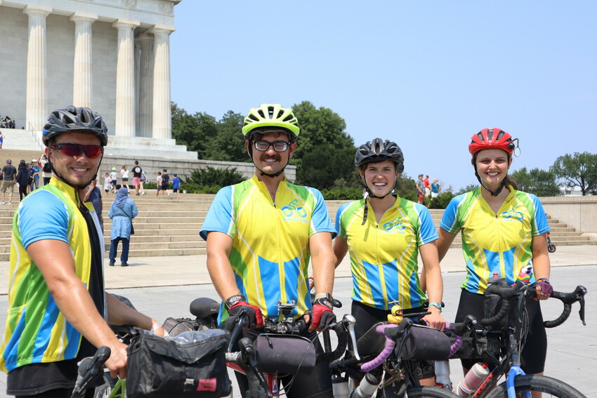 Four MCC SALT alumni participated in the CSCS Climate Ride: (left to right) Loren Friesen, Caleb Schrock-Hurst, Liz Miller and Greta Lapp Klassen. They pause for a photo in front of the Lincoln Memori