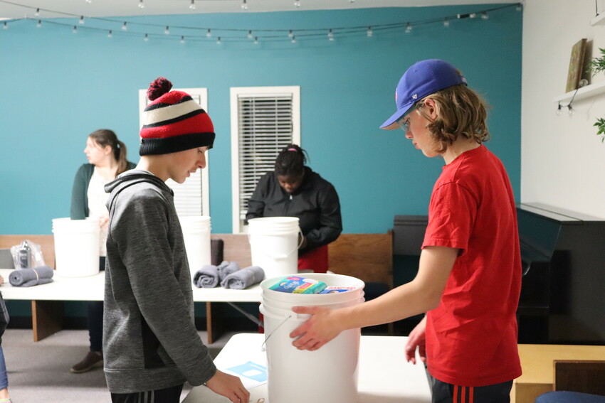 Volunteers at McIvor Avenue Mennonite Brethren Church in Winnipeg, Manitoba, came together in November 2022 to pack relief kits for MCC as part of the Buckets of Thanks initiative.