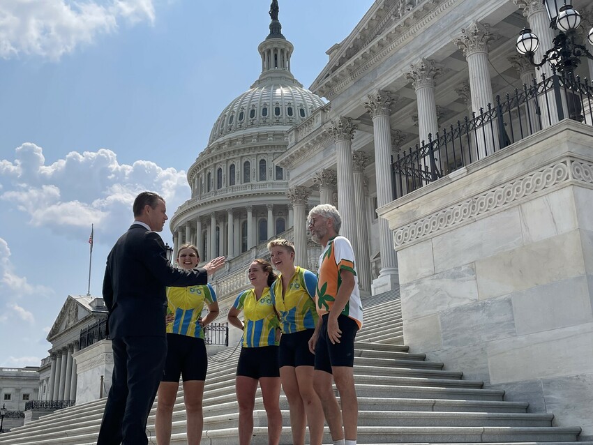 Four cyclists with the Center for Sustainable Climate Solutions meet with Senator Todd Young (R-Ind.) at the U.S. Capitol on July 28, 2021. The Climate Riders spent two months this summer riding from