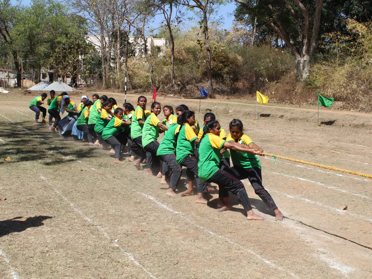 nurses at an employment program in India in a tug of war competition