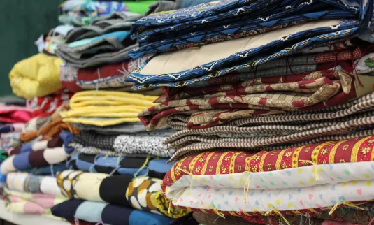 Stacks of colorful comforters