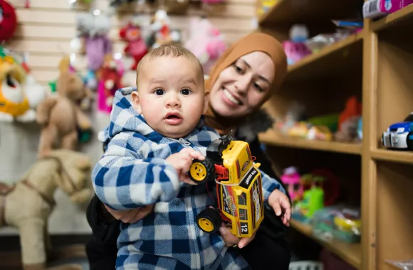 A woman and young child in an MCC Thrift shop