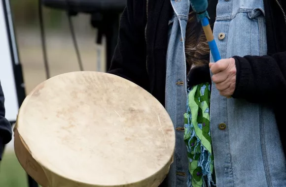 An indigenous hand drum being played