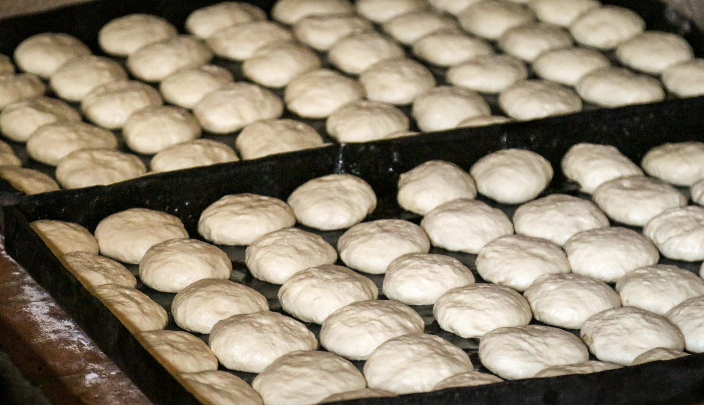 A tray of bread dough rising