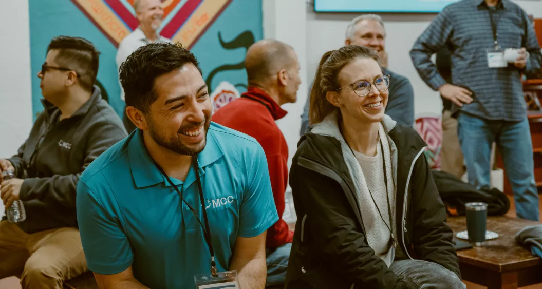 People talking and laughing at a gathering